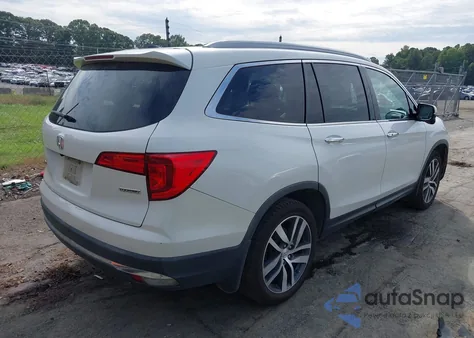 2017 Honda Pilot Touring z USA, uszkodzony, nr VIN 5FNYF5H95HB041397